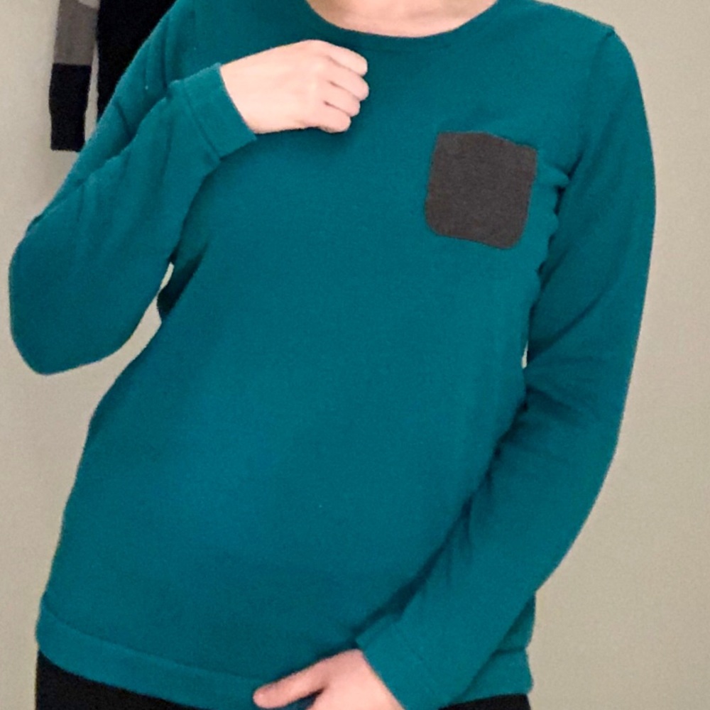 Dark teal sweater with grey pocket